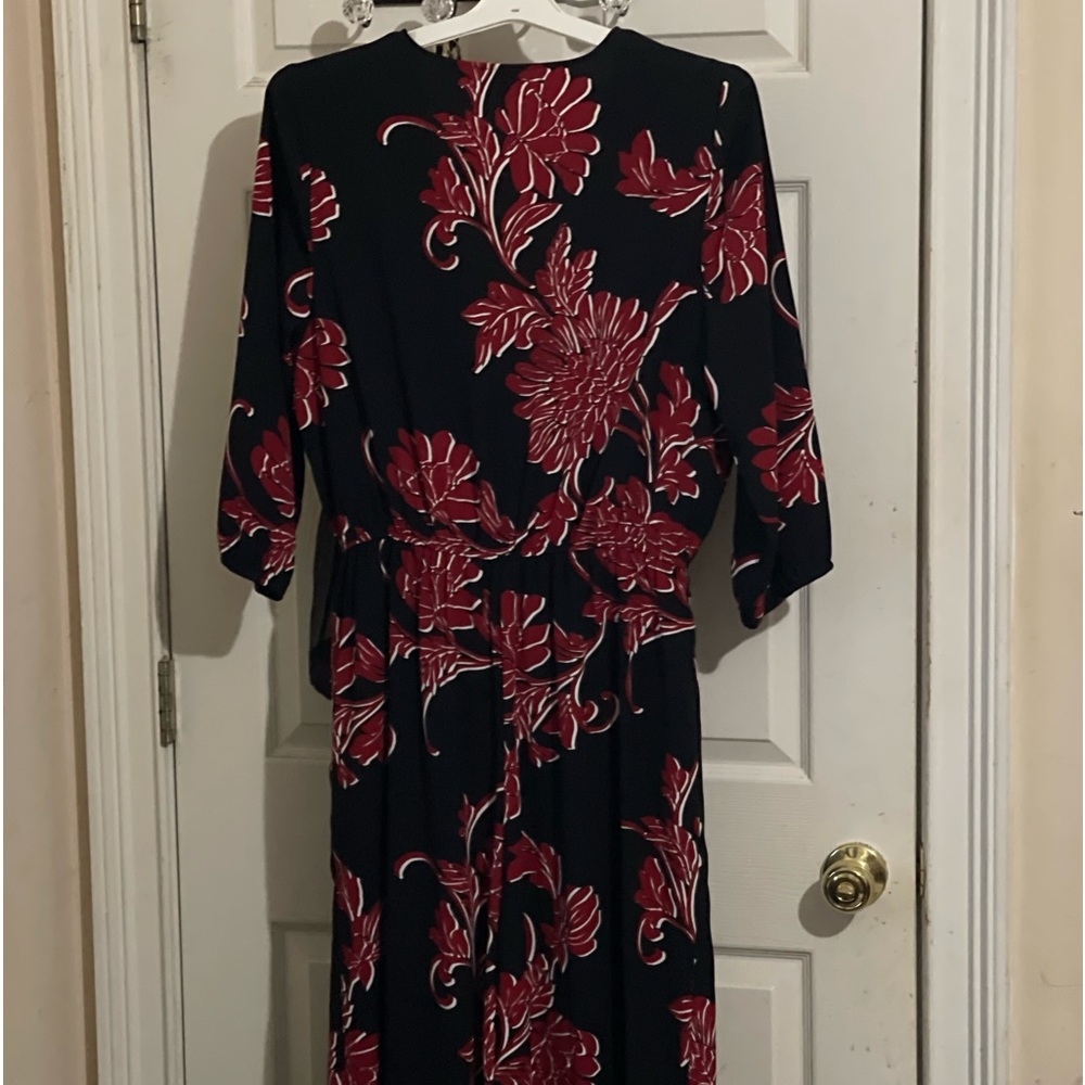 Polyester blend. Can be dressed up or down. Worn once.
